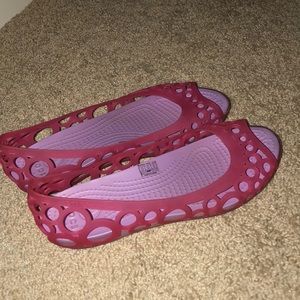 Pink and purple Crocs
